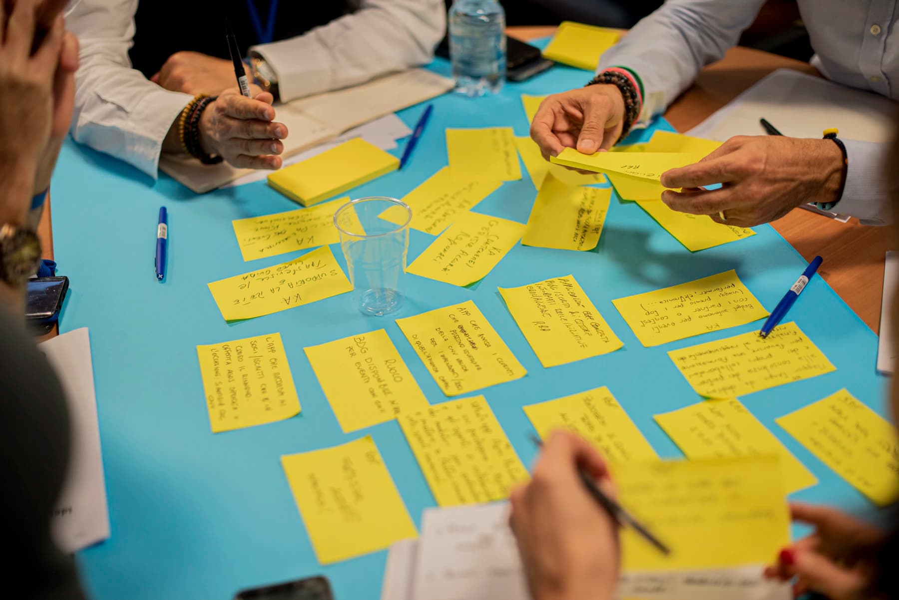 Leaders reviewing workforce capability priorities around a shared workspace